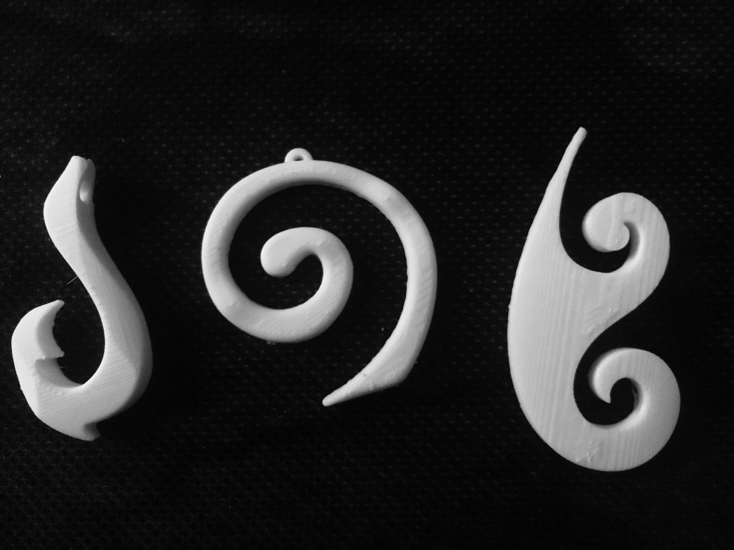 Polynesian pendants, maui, koru, & moana